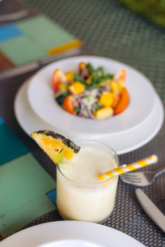 Piña Colada cocktail served at the beachfront bar of Cristal Resort, Zanzibar.