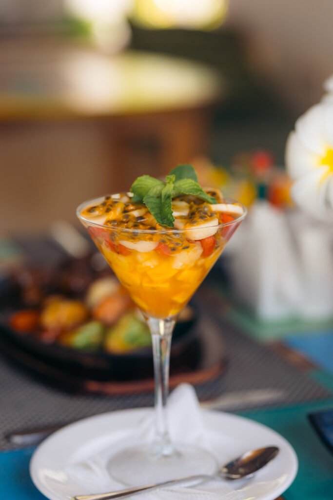 Tropical passion fruit cocktail served at the beachfront bar of Cristal Resort, Zanzibar.