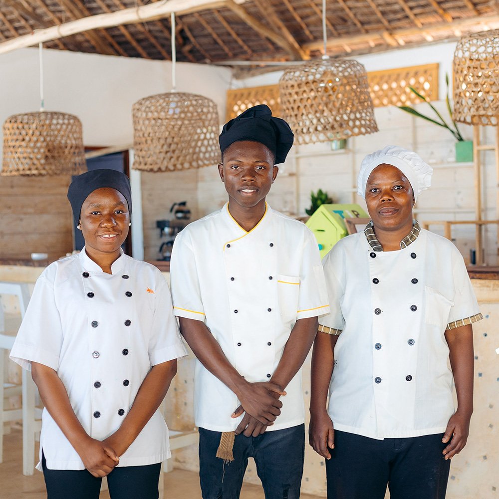 Kitchen team at Cristal Resort preparing fresh, local dishes in Zanzibar.